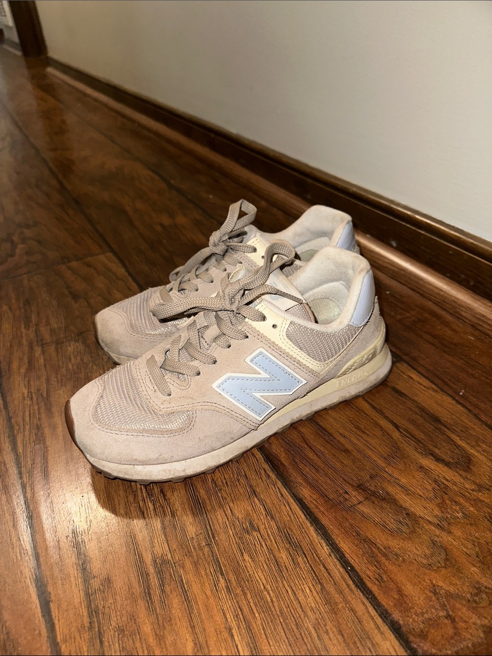 New Balance Beige Sneakers with Light Blue Logo